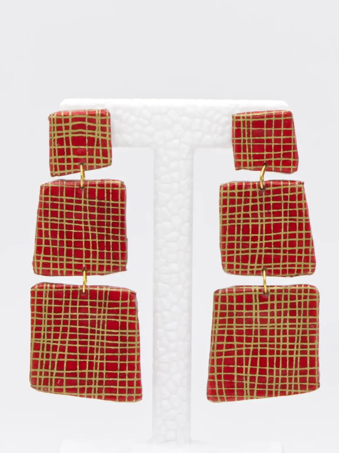 Red and gold patterned triple-drop earrings