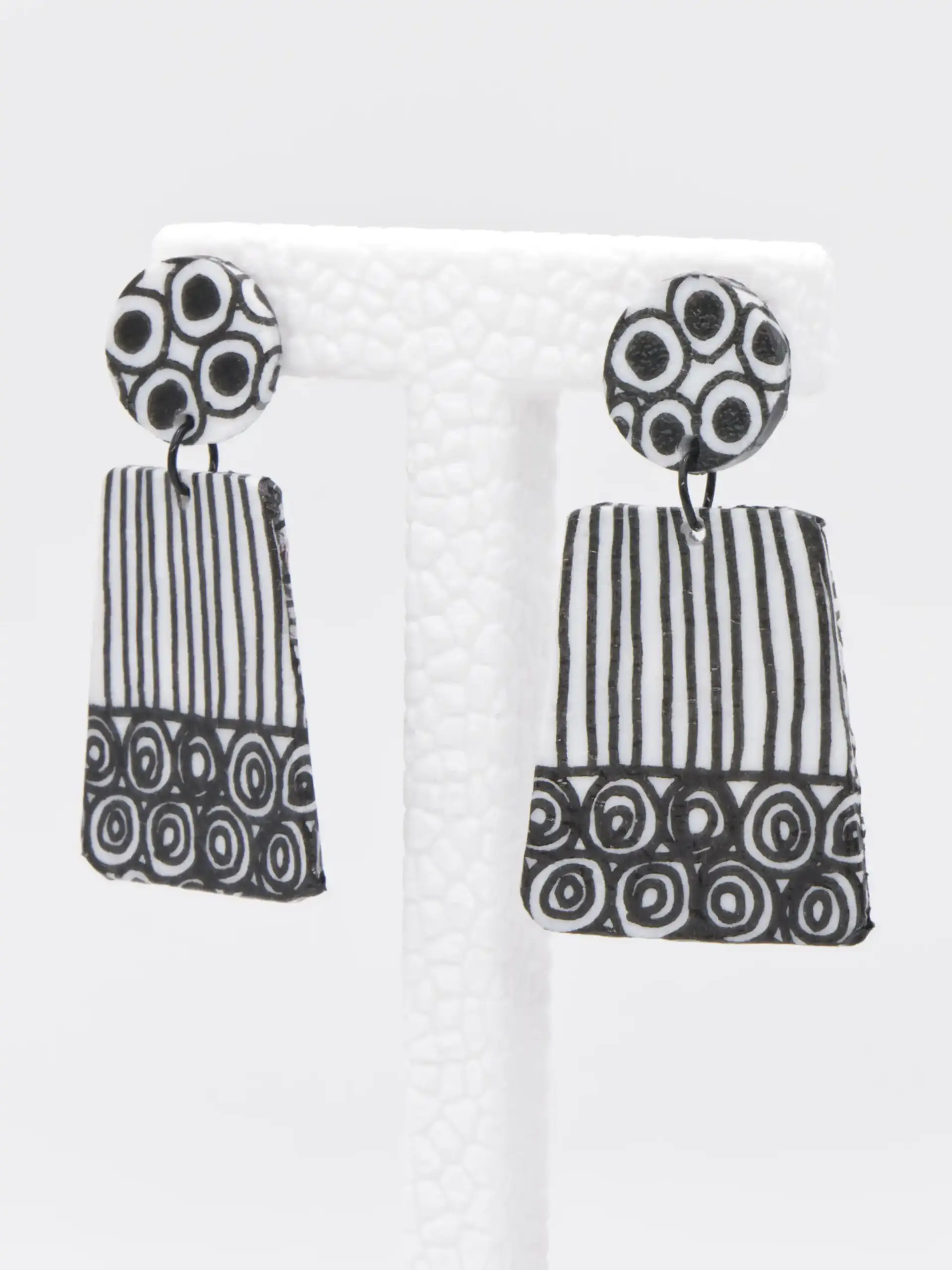 Black and white patterned dangling earrings with rectangular pendants