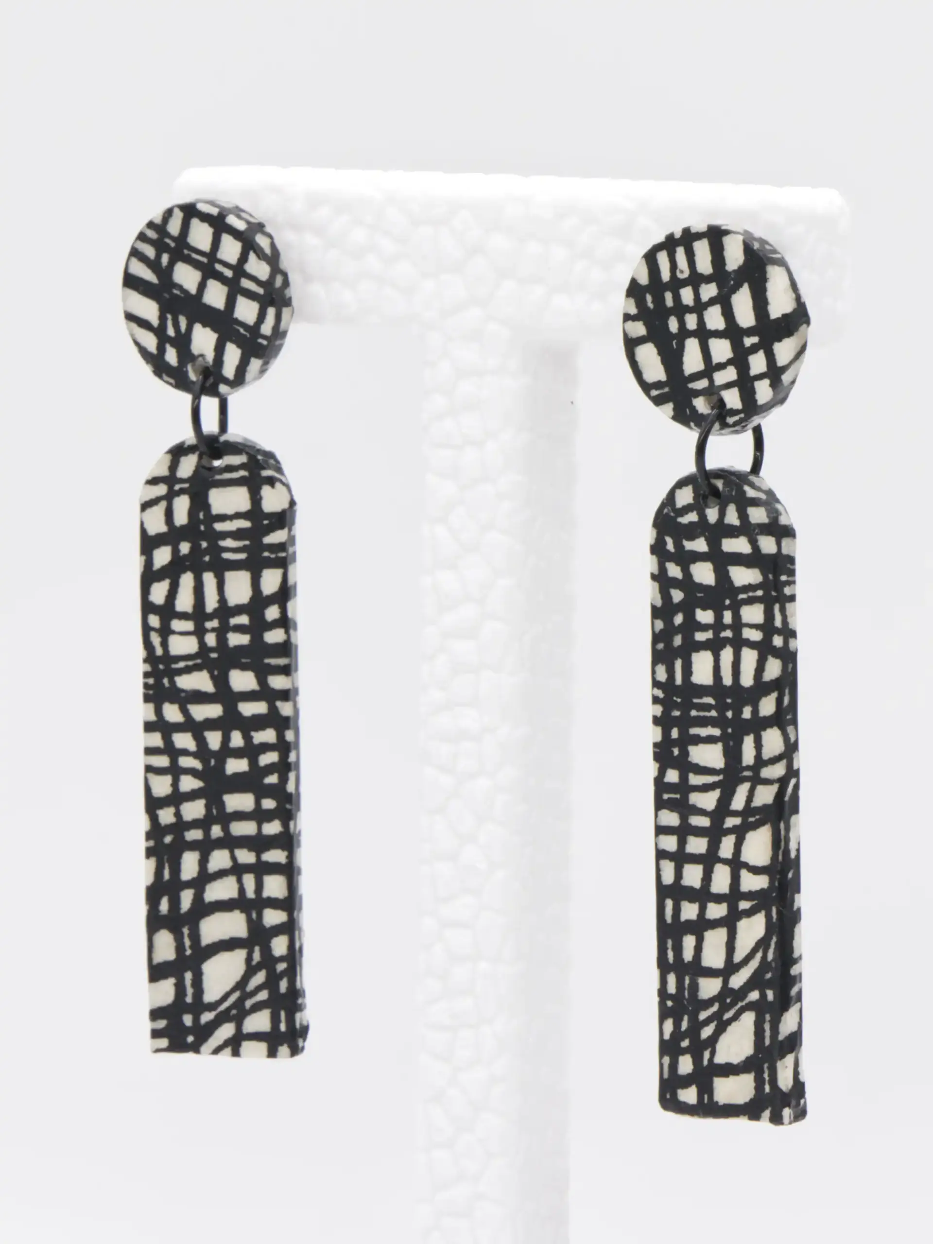 Black and white patterned dangling rectangular earrings