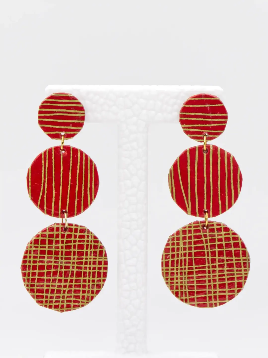 Red and gold patterned triple-disc drop earrings