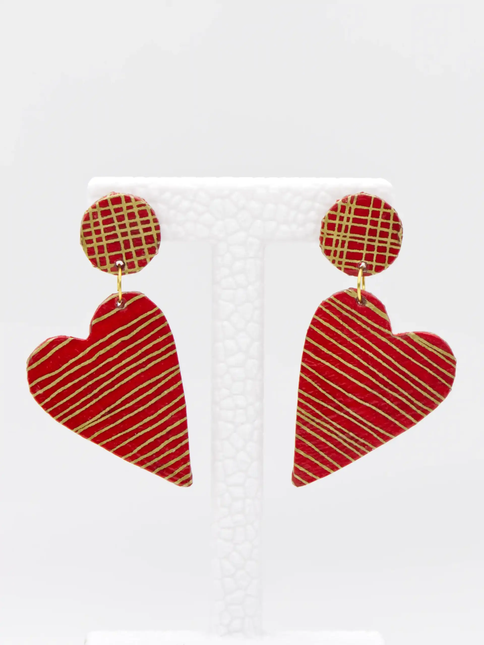 Red heart drop earrings with gold diagonal stripes