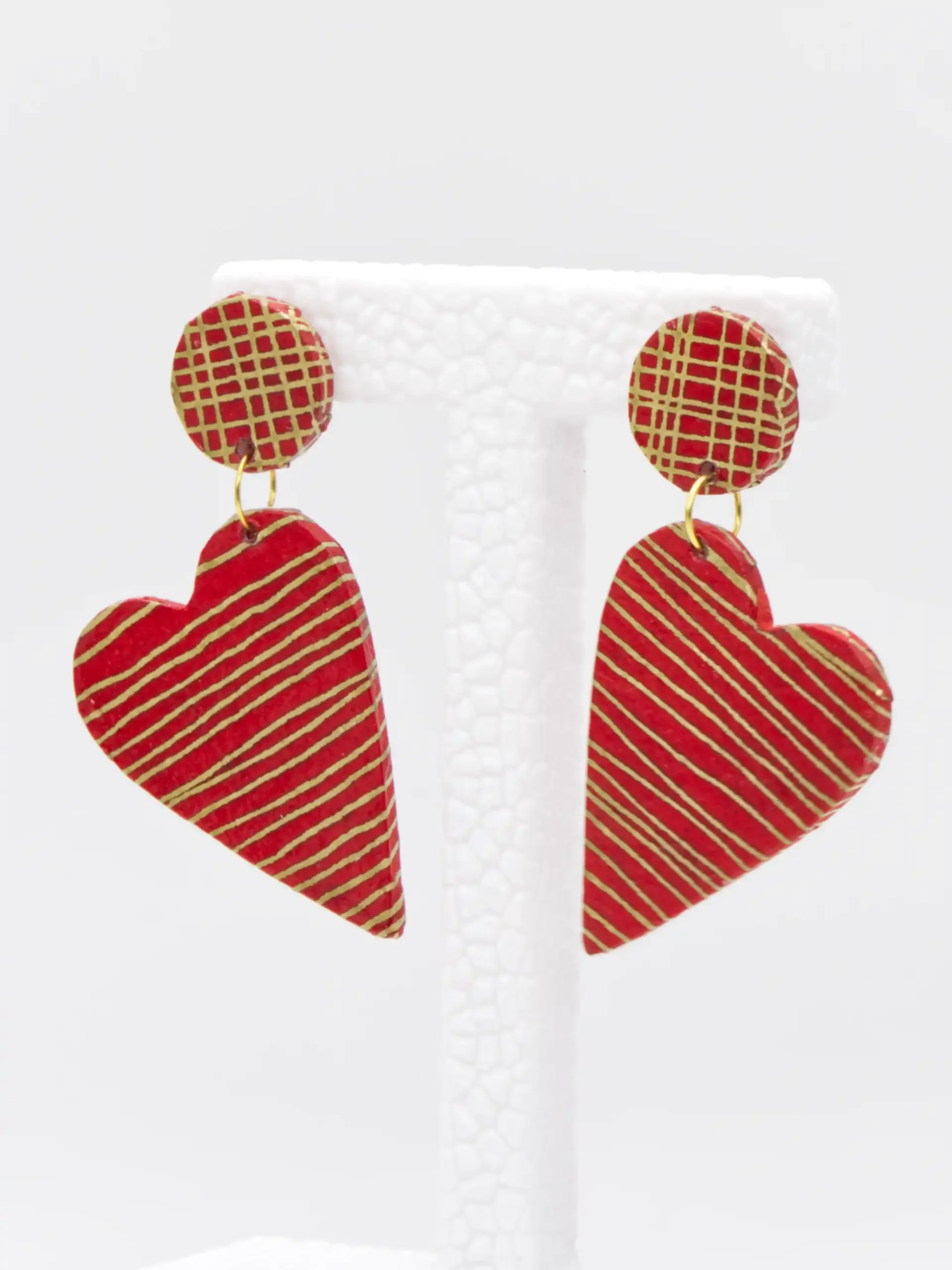 Red and gold striped heart-shaped dangling earrings