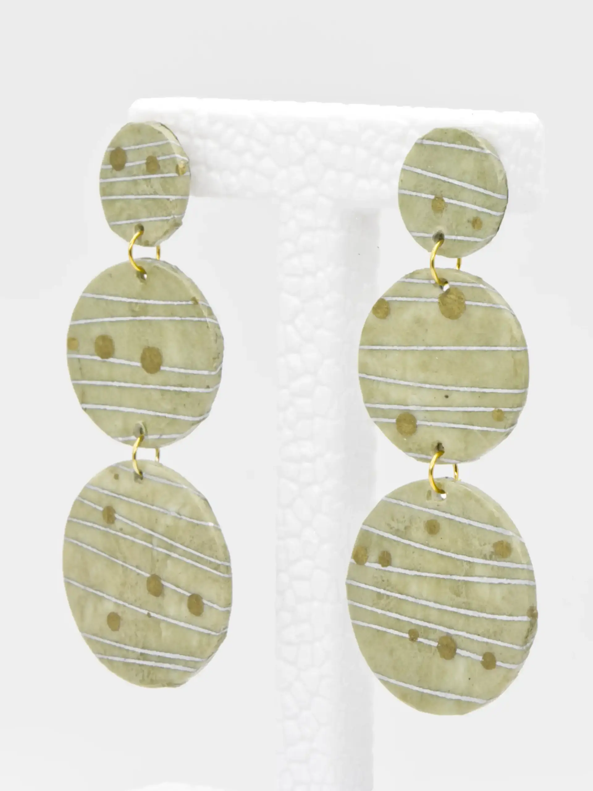 Green striped oval dangle earrings with gold spots