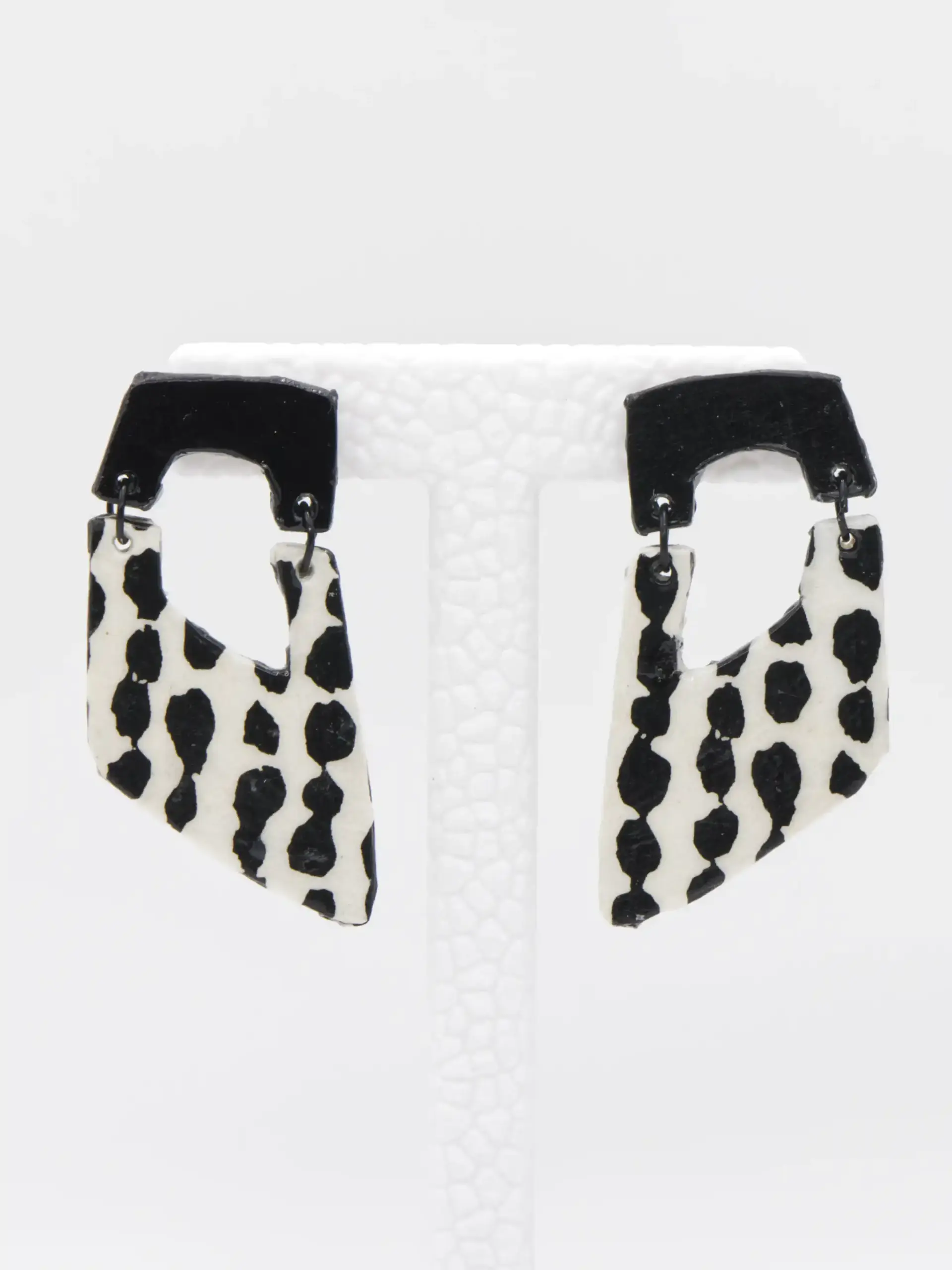 Black and white cow-print dangling earrings