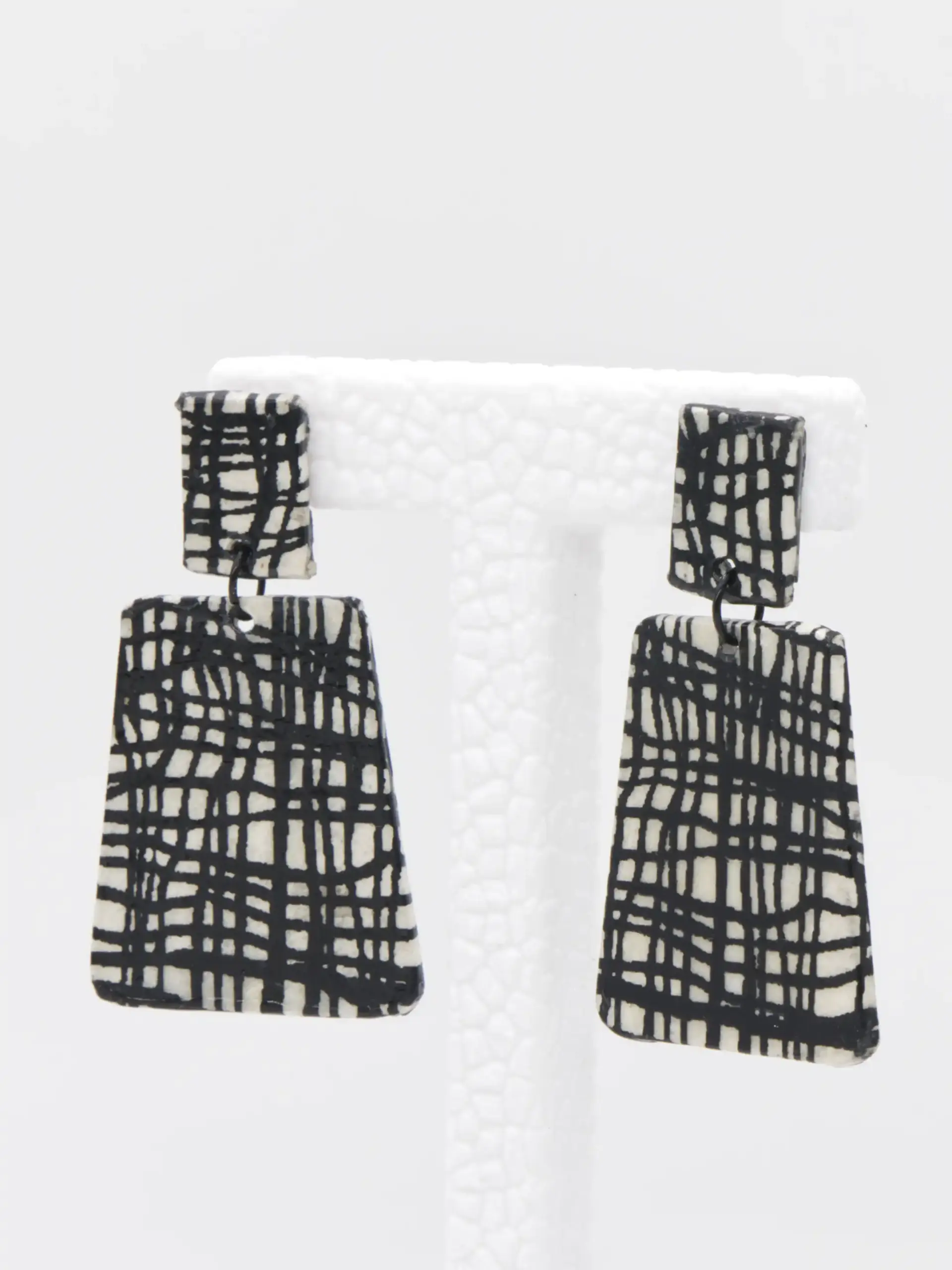Black-and-white patterned rectangular drop earrings